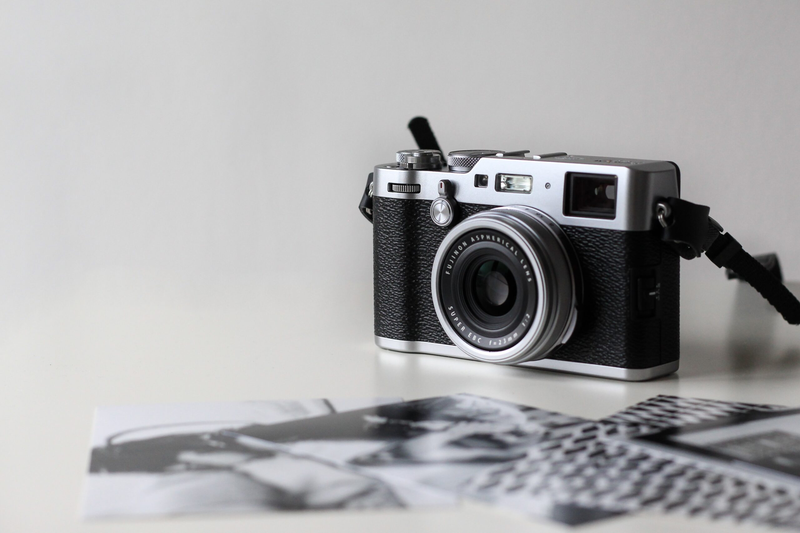 a camera on a table with photos